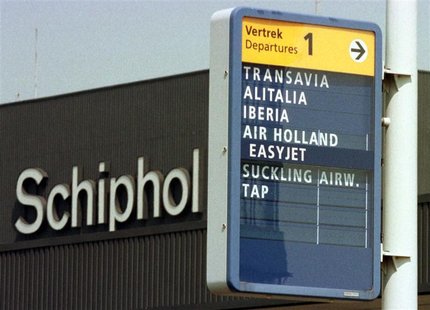 Sign shows direction to the departure of Alitalia and Iberia flights at Amsterdam Schiphol airport on May 12, 1998. REUTERS/Str Old Sign shows direction to the departure of Alitalia and Iberia flights at Amsterdam Schiphol airport on May 12, 1998. REUTERS/Str Old