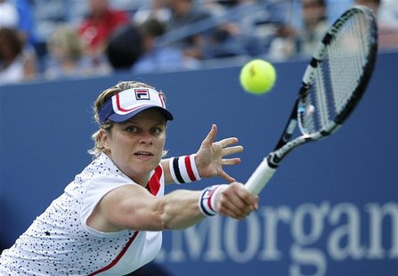 Kim Clijsters of Belgium hits a return to Laura Robson of Britain during their women's singles match at the U.S. Open tennis tournament in N Kim Clijsters of Belgium hits a return to Laura Robson of Britain during their women's singles match at the U.S. Open tennis tournament in N