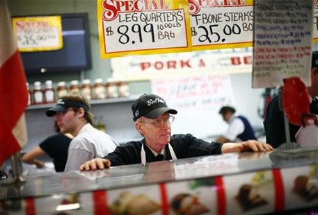 A worker waits for customers at a meat counter in the Broadway Market in Buffalo, New York April 10, 2011. REUTERS/Eric Thayer A worker waits for customers at a meat counter in the Broadway Market in Buffalo, New York April 10, 2011. REUTERS/Eric Thayer