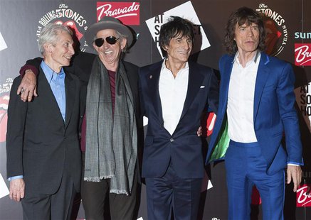 The Rolling Stones (L-R) Charlie Watts, Keith Richards, Ronnie Wood and Mick Jagger pose as they arrive for the opening of the exhibition "R The Rolling Stones (L-R) Charlie Watts, Keith Richards, Ronnie Wood and Mick Jagger pose as they arrive for the opening of the exhibition "R