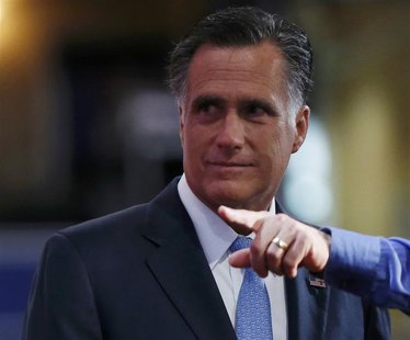 Republican presidential nominee Mitt Romney is shown around the stage during a walk through before the fourth day of the Republican National Republican presidential nominee Mitt Romney is shown around the stage during a walk through before the fourth day of the Republican National