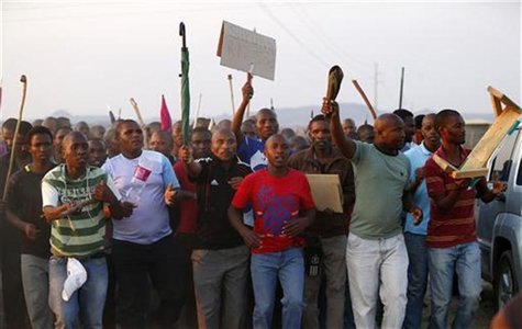 Striking platinum mineworkers gather for a report back on negotiations at Lonmin's Marikana mine in South Africa's North West Province, Augu Striking platinum mineworkers gather for a report back on negotiations at Lonmin's Marikana mine in South Africa's North West Province, Augu
