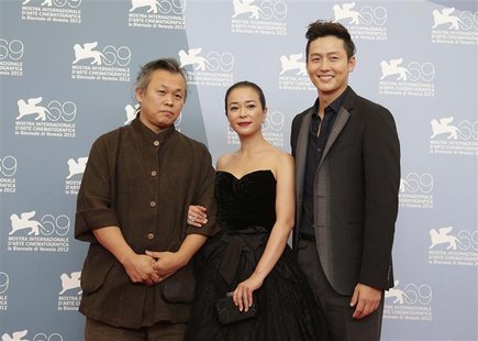 Director Kim Ki-duk (L) poses with actors Lee Jung-jin (R) and Jo Min-soo during the photocall of the movie "Pieta" at the 69th Venice Film Director Kim Ki-duk (L) poses with actors Lee Jung-jin (R) and Jo Min-soo during the photocall of the movie "Pieta" at the 69th Venice Film