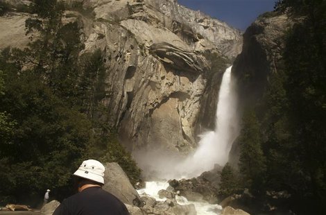 A visitor takes in the view of Upper Yosemite Falls in Yosemite National Park, California May 17, 2009. REUTERS/Robert Galbraith A visitor takes in the view of Upper Yosemite Falls in Yosemite National Park, California May 17, 2009. REUTERS/Robert Galbraith