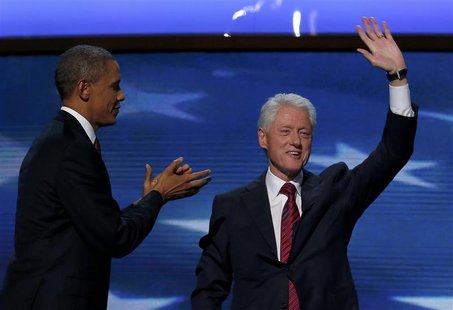 U.S. President Barack Obama (L) joins former U.S. President Bill Clinton onstage after Clinton nominated Obama for re-election during the se U.S. President Barack Obama (L) joins former U.S. President Bill Clinton onstage after Clinton nominated Obama for re-election during the se