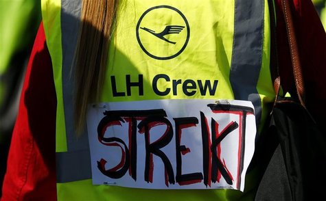Members of German air carrier Lufthansa cabin crew union "UFO" take part in a demonstration during a strike outside a Lufthansa office build Members of German air carrier Lufthansa cabin crew union "UFO" take part in a demonstration during a strike outside a Lufthansa office build
