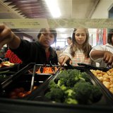 Students get their lunch from a salad bar at the school cafeteria as some of more than 8,000lbs of locally grown broccoli from a partnership Students get their lunch from a salad bar at the school cafeteria as some of more than 8,000lbs of locally grown broccoli from a partnership