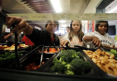 Students get their lunch from a salad bar at the school cafeteria as some of more than 8,000lbs of locally grown broccoli from a partnership Students get their lunch from a salad bar at the school cafeteria as some of more than 8,000lbs of locally grown broccoli from a partnership