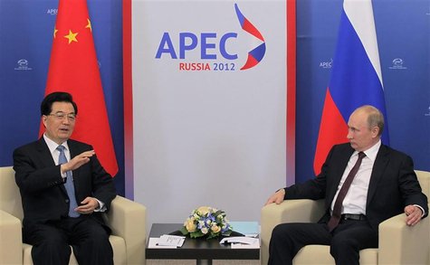 Russian President Vladimir Putin (R) listens to Chinese President Hu Jintao during their meeting at the APEC summit in Vladivostok September Russian President Vladimir Putin (R) listens to Chinese President Hu Jintao during their meeting at the APEC summit in Vladivostok September