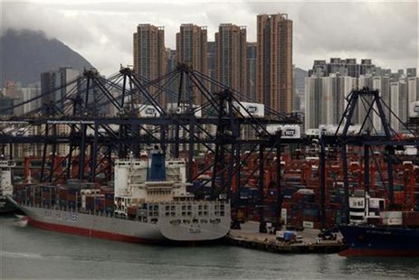 Highrise residential buildings are seen behind container terminals at Hong Kong's Kwai Chung district September 7, 2012. REUTERS/Bobby Yip Highrise residential buildings are seen behind container terminals at Hong Kong's Kwai Chung district September 7, 2012. REUTERS/Bobby Yip