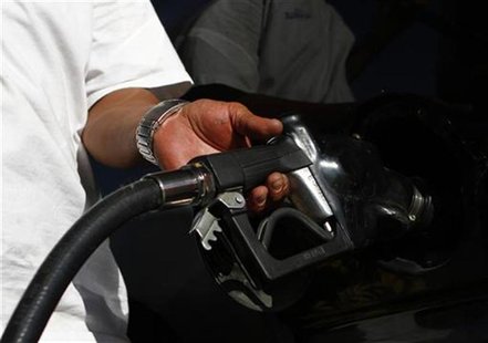 A motorist pumps fuel into his vehicle at JJ's Express Gas Plus station in Phoenix gas station in Phoenix, Arizona August 10, 2011. REUTERS/ A motorist pumps fuel into his vehicle at JJ's Express Gas Plus station in Phoenix gas station in Phoenix, Arizona August 10, 2011. REUTERS/