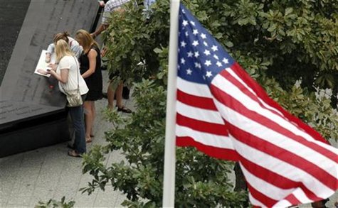 Family members of the victims of the World Trade Center attacks look over one of the Twin Memorial pools at Ground Zero during ceremonies ma Family members of the victims of the World Trade Center attacks look over one of the Twin Memorial pools at Ground Zero during ceremonies ma