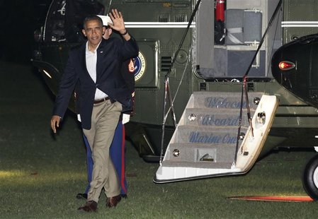 U.S. President Barack Obama waves as he walks on the South Lawn of the White House upon his return from Florida to Washington September 9, 2 U.S. President Barack Obama waves as he walks on the South Lawn of the White House upon his return from Florida to Washington September 9, 2
