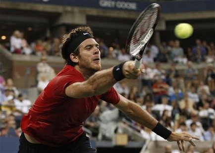 Juan Martin Del Potro of Argentina returns to Novak Djokovic of Serbia during their men's singles quarterfinals match at the U.S. Open tenni Juan Martin Del Potro of Argentina returns to Novak Djokovic of Serbia during their men's singles quarterfinals match at the U.S. Open tenni