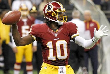 Washington Redskins quarterback Robert Griffin III (10) drops back to pass as his team takes on the New Orleans Saints during their NFL foot Washington Redskins quarterback Robert Griffin III (10) drops back to pass as his team takes on the New Orleans Saints during their NFL foot