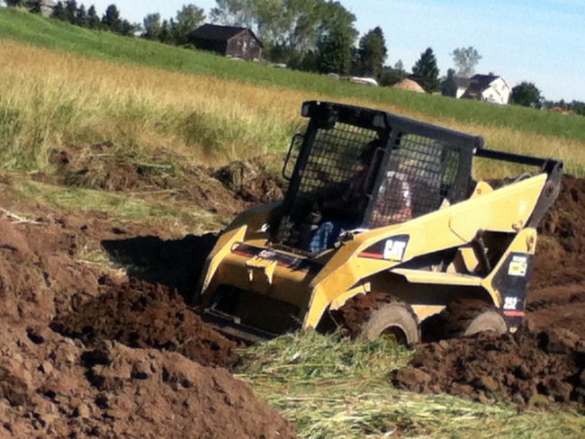 Digging out a mud pit