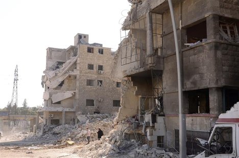 Damaged buildings are seen after an explosion on Sunday ripped through the northern Syrian city of Aleppo September 10, 2012. REUTERS/George Damaged buildings are seen after an explosion on Sunday ripped through the northern Syrian city of Aleppo September 10, 2012. REUTERS/George