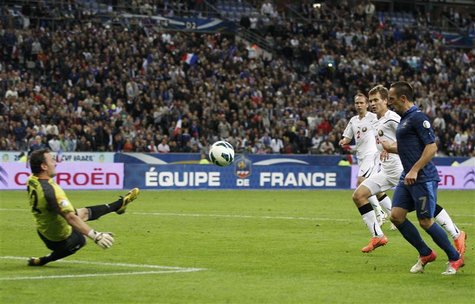 France's Franck Ribery shoots and scores the third goal for the team during their World Cup qualifying soccer match against Belarus in Saint France's Franck Ribery shoots and scores the third goal for the team during their World Cup qualifying soccer match against Belarus in Saint