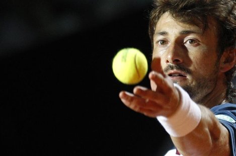 Juan Carlos Ferrero of Spain serves the ball to Roger Federer of Switzerland during their match at the Rome Masters tennis tournament May 17 Juan Carlos Ferrero of Spain serves the ball to Roger Federer of Switzerland during their match at the Rome Masters tennis tournament May 17