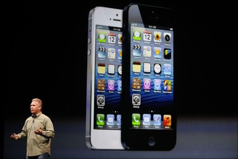 Phil Schiller, senior vice president of worldwide marketing at Apple Inc., introduces the iPhone 5 during Apple Inc.'s iPhone media event in Phil Schiller, senior vice president of worldwide marketing at Apple Inc., introduces the iPhone 5 during Apple Inc.'s iPhone media event in