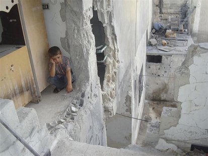A boy sits at his parents' house, damaged by shelling by forces loyal to Syria's President Bashar al-Assad, in Talbiseh, near Homs August 31 A boy sits at his parents' house, damaged by shelling by forces loyal to Syria's President Bashar al-Assad, in Talbiseh, near Homs August 31