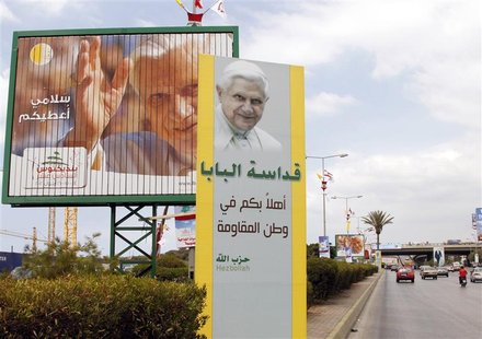 Billboards and a banner (R) erected by Hezbollah depicting Pope Benedict XVI are seen installed at the main airport road in Beirut September Billboards and a banner (R) erected by Hezbollah depicting Pope Benedict XVI are seen installed at the main airport road in Beirut September