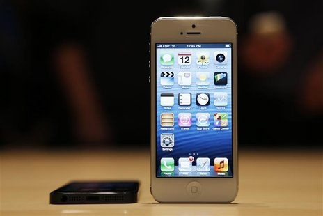 The iPhone 5 on display after its introduction during Apple Inc.'s iPhone media event in San Francisco, California September 12, 2012. REUTE The iPhone 5 on display after its introduction during Apple Inc.'s iPhone media event in San Francisco, California September 12, 2012. REUTE