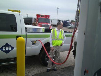 CNG (Compressed Natural Gas) vehicle being filled with fuel CNG (Compressed Natural Gas) vehicle being filled with fuel
