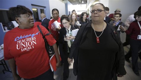 Chicago Teachers Union President Karen Lewis (R) leaves a press conference on the fifth day of their strike in Chicago, September 14, 2012. Chicago Teachers Union President Karen Lewis (R) leaves a press conference on the fifth day of their strike in Chicago, September 14, 2012.