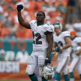 Miami Dolphins' Reggie Bush leaves the field after his team defeated the Oakland Raiders in their NFL football game in Miami Gardens, Florid