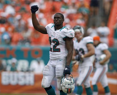 Miami Dolphins' Reggie Bush leaves the field after his team defeated the Oakland Raiders in their NFL football game in Miami Gardens, Florid Miami Dolphins' Reggie Bush leaves the field after his team defeated the Oakland Raiders in their NFL football game in Miami Gardens, Florid