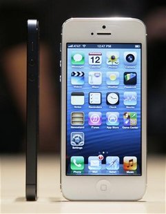 The iPhone 5 on display after its introduction during Apple Inc.'s iPhone media event in San Francisco, California September 12, 2012. REUTE The iPhone 5 on display after its introduction during Apple Inc.'s iPhone media event in San Francisco, California September 12, 2012. REUTE