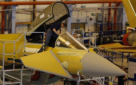 A member of staff works in the cockpit of an aircraft on the Eurofighter Typhoon production line at BAE systems Warton plant near Preston, n A member of staff works in the cockpit of an aircraft on the Eurofighter Typhoon production line at BAE systems Warton plant near Preston, n