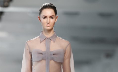 A model presents a creation from the Christopher Kane Spring/Summer 2013 collection at London Fashion Week September 17, 2012. REUTERS/Suzan A model presents a creation from the Christopher Kane Spring/Summer 2013 collection at London Fashion Week September 17, 2012. REUTERS/Suzan