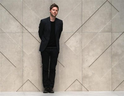 Chief Creative Officer of Burberry Christopher Bailey walks on the catwalk following the presentation of the Burberry Spring/Summer 2013 col Chief Creative Officer of Burberry Christopher Bailey walks on the catwalk following the presentation of the Burberry Spring/Summer 2013 col