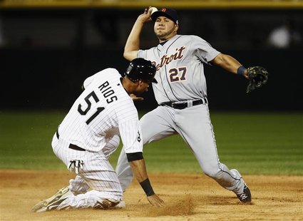 Chicago White Sox right fielder Alex Rios (51) breaks up a double play as Detroit Tigers shortstop Jhonny Peralta (27) tried to make the pla Chicago White Sox right fielder Alex Rios (51) breaks up a double play as Detroit Tigers shortstop Jhonny Peralta (27) tried to make the pla