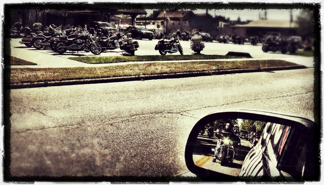 Motorcycles parked everywhere..including my rear view mirror!!