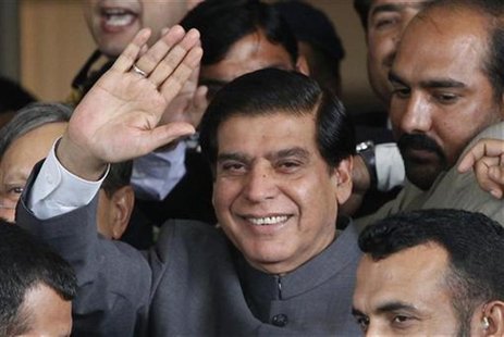 Pakistan's Prime Minister Raja Pervez Ashraf waves to the media after arriving at the Supreme Court in Islamabad September 18, 2012. REUTERS Pakistan's Prime Minister Raja Pervez Ashraf waves to the media after arriving at the Supreme Court in Islamabad September 18, 2012. REUTERS