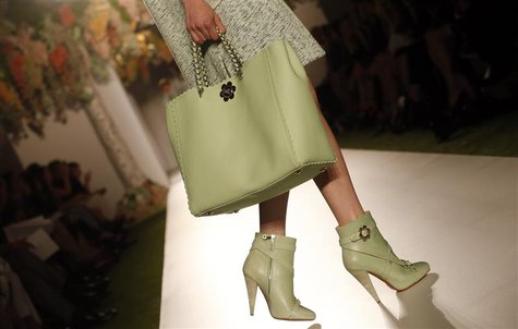 A model presents a creation from the Mulberry Spring/Summer 2013 collection at London Fashion Week September 18, 2012. REUTERS/Suzanne Plunk A model presents a creation from the Mulberry Spring/Summer 2013 collection at London Fashion Week September 18, 2012. REUTERS/Suzanne Plunk