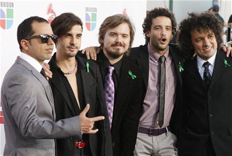 Members of the Venezuelan band Los Amigos Invisibles pose at the 10th annual Latin Grammy awards in Las Vegas, Nevada November 5, 2009. REUT Members of the Venezuelan band Los Amigos Invisibles pose at the 10th annual Latin Grammy awards in Las Vegas, Nevada November 5, 2009. REUT