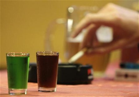 Two shots of liquor and cigarette are seen at a bar in Prague September 12, 2012. REUTERS/David W Cerny Two shots of liquor and cigarette are seen at a bar in Prague September 12, 2012. REUTERS/David W Cerny