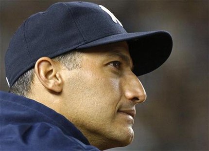 New York Yankees starting pitcher Andy Pettitte looks on from the dugout against the Atlanta Braves during the ninth inning of their MLB Int New York Yankees starting pitcher Andy Pettitte looks on from the dugout against the Atlanta Braves during the ninth inning of their MLB Int