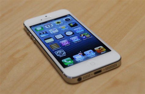 The iPhone 5 on display after its introduction during Apple Inc.'s iPhone media event in San Francisco, California September 12, 2012. REUTE The iPhone 5 on display after its introduction during Apple Inc.'s iPhone media event in San Francisco, California September 12, 2012. REUTE