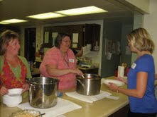 Jaclyn Slavens and Trisha Loiselle serve Volunteer Brenda Stecker Jaclyn Slavens and Trisha Loiselle serve Volunteer Brenda Stecker