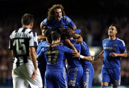 Chelsea's Oscar (unseen) celebrates with teammates after scoring a goal against Juventus during their Champions League soccer match at Stamf Chelsea's Oscar (unseen) celebrates with teammates after scoring a goal against Juventus during their Champions League soccer match at Stamf