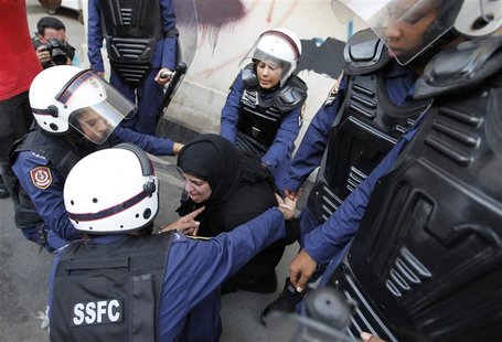 Riot policewomen arrest an anti-government protester during a demonstration in capital Manama, September 21, 2012. REUTERS/Hamad I Mohammed Riot policewomen arrest an anti-government protester during a demonstration in capital Manama, September 21, 2012. REUTERS/Hamad I Mohammed