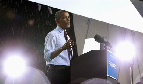 During a brief rainstorm, U.S. President Barack Obama speaks at a campaign rally at the Henry Maier Festival in Milwaukee, Wisconsin Septemb During a brief rainstorm, U.S. President Barack Obama speaks at a campaign rally at the Henry Maier Festival in Milwaukee, Wisconsin Septemb