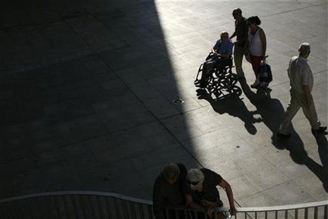 A pensioner sits in a wheelchair in the Andalusian capital of Seville September 20, 2012. REUTERS/Marcelo del Pozo A pensioner sits in a wheelchair in the Andalusian capital of Seville September 20, 2012. REUTERS/Marcelo del Pozo