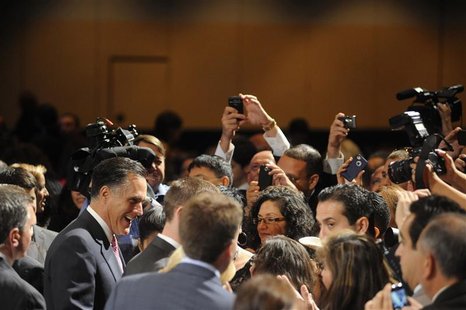 Republican presidential candidate Mitt Romney shakes hands with the crowd after addressing the National Association of Latino Elected and Ap Republican presidential candidate Mitt Romney shakes hands with the crowd after addressing the National Association of Latino Elected and Ap
