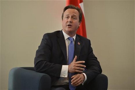 Britain's Prime Minister David Cameron speaks during a news conference with French President Francois Hollande in east London September 6, 2 Britain's Prime Minister David Cameron speaks during a news conference with French President Francois Hollande in east London September 6, 2